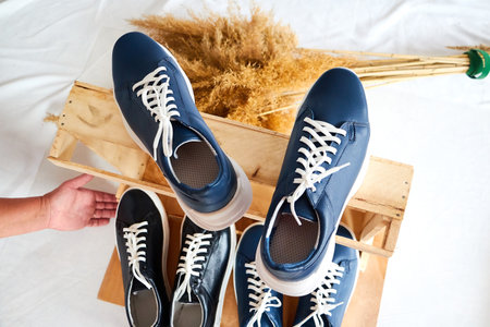 Fashionable suede sneakers. Sport shoes. Expensive footwear or loafers isolated on white background...