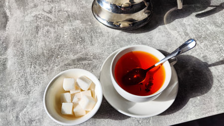 Black tea in porcelain white cup on the table in vintage place. tea ceremonyの写真素材