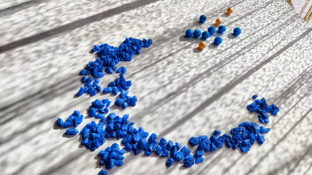 Many small blue stones, pebbles and few beads. materials for handmade. Abstract background, texture, frame, pattern, and copy space. Concept of environment, pressure by the majority of small groupの写真素材