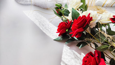 Background and texture with beautiful white and red roses with light and shadow from sun. Abstract cart with frame framed with roses, copy space and place for text. Concept of gifts, beauty, holidayの写真素材