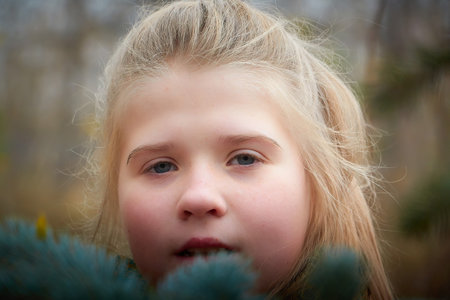 Kirov, Russia - October 23, 2022: Cute teenager blonde girl enjoying outdoors in city park in autumn dayのeditorial素材