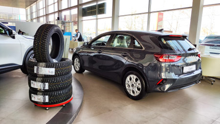 Cheboksary, Russia - April 05, 2023: Cars in showroom of dealership KIA. Re-export to Russia