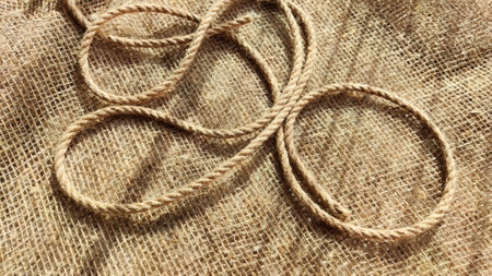 Burlap fabric, coarse jute weave and thick burlap rope. Background, texture, pattern, and frame.の写真素材