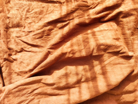 Abstract background and texture of crumpled brown fabric. Texture, pattern, frame and copy spaceの写真素材