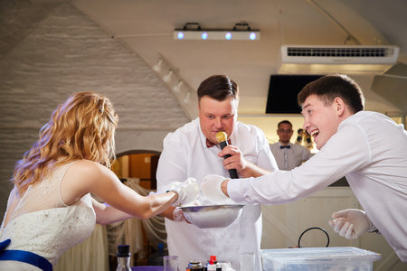 Kirov, Russia - July 18, 2020: The bride and groom during chemical show during the wedding celebration. An unusual celebration and performanceのeditorial素材