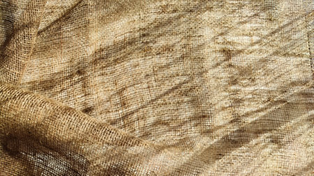 Natural fabric texture, frame and background of burlap. Rough crumpled burlap background. selective focusの写真素材