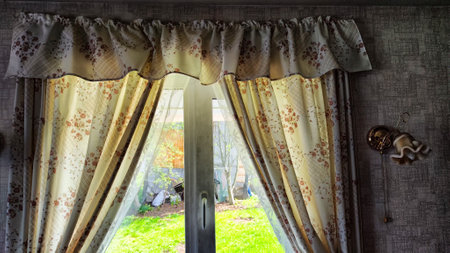 Beautiful curtain on the window and transparent tulle curtain. Abstract background, texture and pattern. Space for text and copy spaceの写真素材