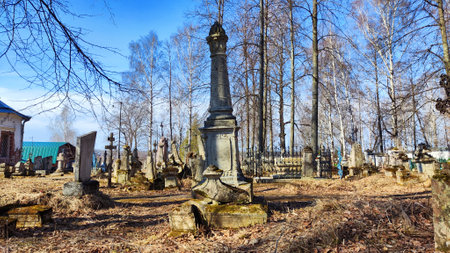 Sovetsk, Russia - April 03, 2023: Cemetery with old tombstones on sunny day in spring. Image with selective focusのeditorial素材