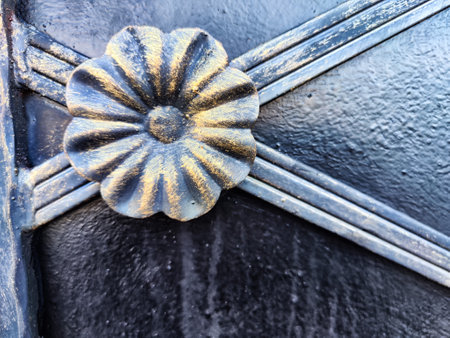 Fragment of forged metal products close-up. Beautiful flower, handmade. Abstract background,...