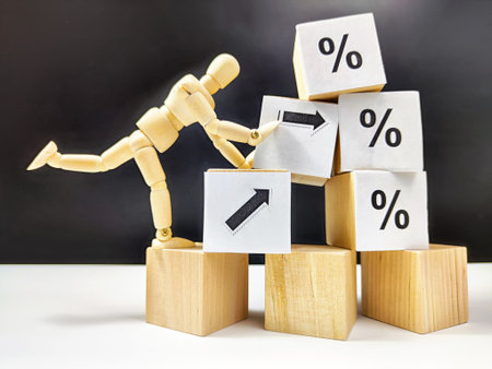 Little wooden man, cubes in a pyramid and growth arrows and percent signs. The concept of applying...