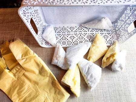 Plastic bag folded into triangle for storage. Ways of storing and laying at homeの写真素材