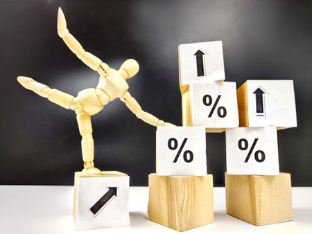 Little wooden man, cubes in a pyramid and growth arrows and percent signs. The concept of applying...