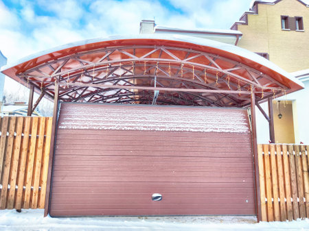 New gates to the private territory on winter day and snow. Metallic texture and backgroundの写真素材