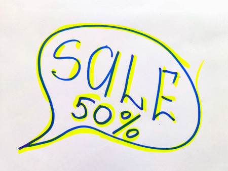 White sign with a yellow and blue inscription sale. The concept of a sale offer in business, trade,...