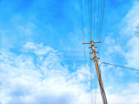 Old pole with wires against the sky. Electric transmission line, Eco-friendly energyの写真素材
