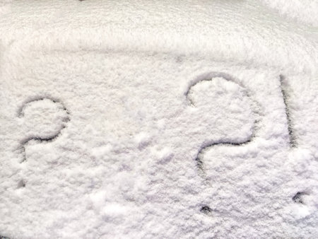 Two question and exclamation marks written in snow. The cold frosty texture of the snow and the question mark. Background, place for text, copy spaceの写真素材