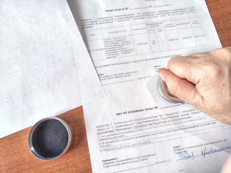 Kirov, Russia - February 16, 2024: A hand stamping seal on an official form. Document Official Being...