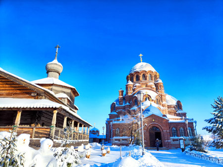 Orthodox old wooden church with dome against the backdrop of a spring or winter sky. Beautiful old historic temple. Maslenitsa, Easterの写真素材