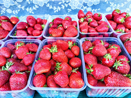 A close-up of basket filled with freshly picked red strawberries. Background, texture, pattern,...