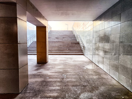 quiet underground passage opens to stairs ascending into bright daylight