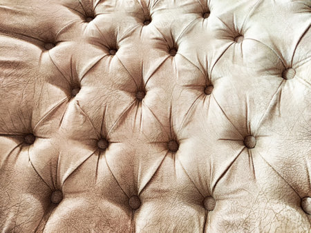 Detailed view of a tufted leather surface showing its unique texture and craftsmanship.の写真素材
