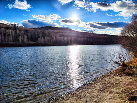 Sunset on the lake in the autumn forest. Beautiful nature landscape.