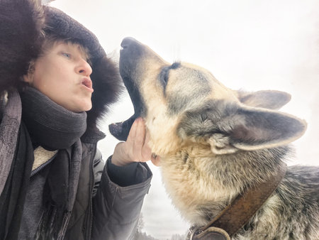 Portrait of Middle aged woman, adult girl, mature lady taking selfie and having fun with shepherd...