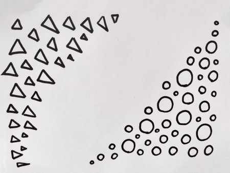Black triangles and circles are arranged in two distinct patterns, showing casing geometric design on a stark white surface.の写真素材