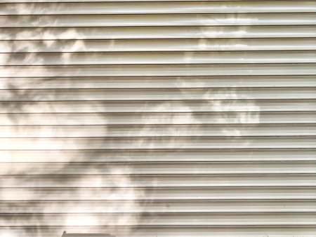 The surface showcases a textured design with subtle light play and ample space for adding text or graphics, ideal for creative projects.の写真素材