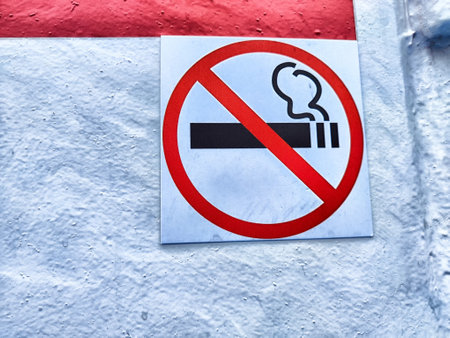 A clear no smoking sign displayed on a wall, emphasizing a tobacco-free environment.の写真素材