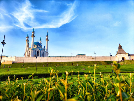 A stunning castle and mosque Kul Sharif stand against backdrop of a colorful sky at sunset in Kazanの写真素材