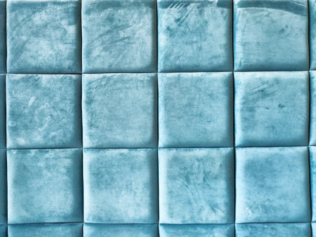 Soft light teal wall panels create a plush, inviting atmosphere, perfect for contemporary home or office design.の写真素材