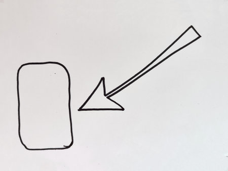 A hand-drawn arrow clearly directs attention to a rectangular shape on a plain surface,...