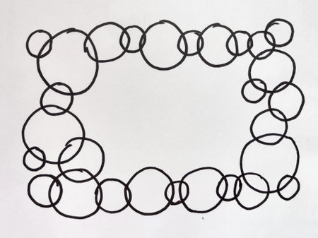A continuous line drawing of circles forms a rectangular frame, showing blank white space inside for artistic purposes.の写真素材