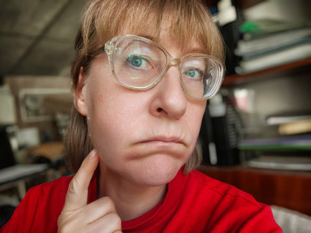 A woman appears distressed with a swollen cheek and bruising, indicating signs of dental issues.