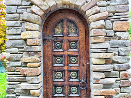 This unique stone archway door features beautiful carvings.の写真素材