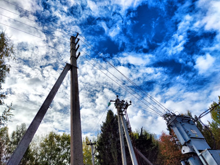 Old pole with wires against the sky. Electric transmission line, Eco-friendly energy