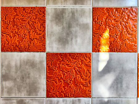 The design features striking red and silver decorative tiles arranged in a pattern with room for additional text and creativity.の写真素材