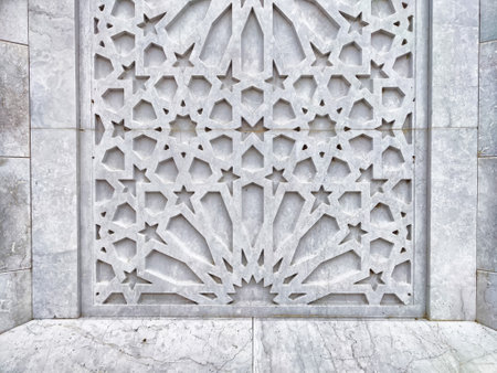 A stunning gray relief showcases detailed geometric patterns and stars, illustrating intricate craftsmanship and artistic design.の写真素材