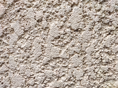 The surface features a light gray, rough texture ideal for framing text or graphics, providing a solid backdrop for design projects.の写真素材