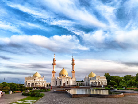 A white mosque in Kazan, Russia stands under cloudy sky at sunsetの写真素材