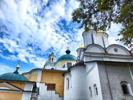 Visit the Kremlin in Yaroslavl to admire its beautiful architecture against a backdrop of dynamic clouds and clear blue skies.の写真素材