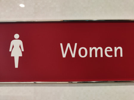 Restroom sign indicating the women's facilities in a contemporary setting with a bold design.の写真素材