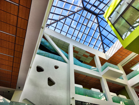 The vibrant interior of a modern Innopolis building features open spaces and a striking glass ceiling.の写真素材