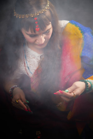 Elegant woman dressed in vibrant sari showcases Indian culture during a captivating photoshootの写真素材