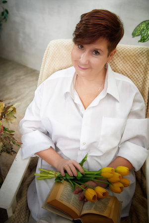 Celebrating Womens Day with tulips in a cozy room settingの写真素材