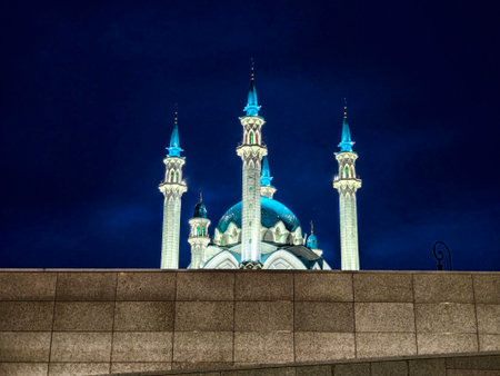A captivating view of Kazan main mosque showcasing its illuminated minarets and dome under the night sky, creating a serene ambiance.の写真素材