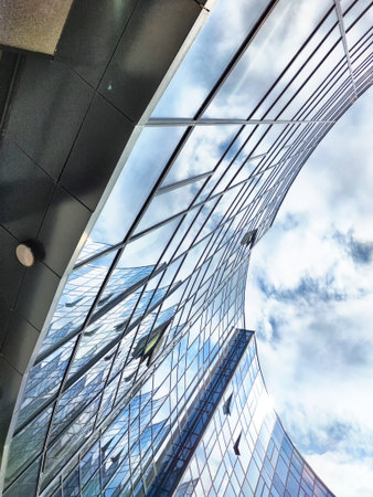 Tall buildings with sleek glass facades in Innopolis reflect the sky, showing contemporary architectural design and urban aesthetics.の写真素材