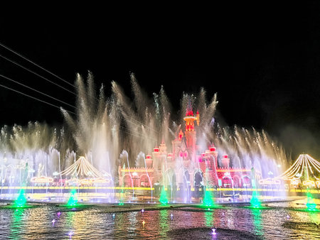 Tashkent, Uzbekistan - April 09, 2025: A spectacular fountain display lights up the night sky in Tashkent's Magic City, creating a colorful scene with water jets and vibrant lights.の写真素材