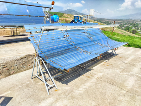 Solar panels are arranged in an outdoor area, capturing sunlight under a clear blue sky with...